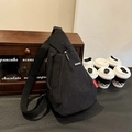 Black nylon EVOL GEAR crossbody chest bag with adjustable strap and red tag detail - Black