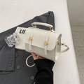 Chic white leather mini square bag with dual gold metal buckles and top handle - Off White