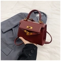 Close-up of wine red matte leather mini Kelly bag with gold twist lock and handle - Red / 19.5cm x 14cm x 8cm