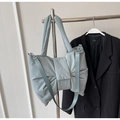 Detailed shot of mint blue oversized bow tote bag in nylon fabric with crossbody strap - Blue