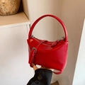 Elegant red patent leather crossbody bag with rounded handle and silver hardware - Red