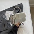 Silver woven texture crossbody bag with top handle and fashion logo tag on gray blazer - Silver Large