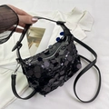 Chic black sequin crescent crossbody bag with shimmering finish and dual straps - Black