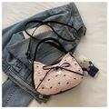 Pink pleated crossbody bag with black bow patterns and a heart-shaped metal pendant - Pink With Pendant