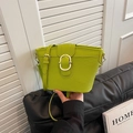 Fruit green woven bucket bag with smooth leather flap and golden oval buckle - Green