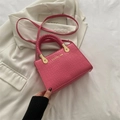 Rose pink crocodile pattern crossbody bag with a woven handle and chain detail - Pink