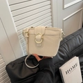 Minimalist beige bucket bag with woven texture and gold ring buckle closure - Off White