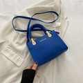 Royal blue faux crocodile leather handbag with woven handle and gold hardware detail - Klein Blue