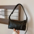 Minimalist black faux leather baguette shoulder bag with adjustable strap and silver zipper - Black