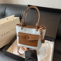 Mini borsa a secchiello in denim azzurro con finiture in pelle marrone e tracolla - Marrone
