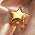 Polished gold stainless steel star open ring displayed on champagne silk fabric - Golden Style (N5703)