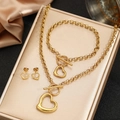 Set gioielli in acciaio dorato con pendenti a cuore vuoto e chiusura a levetta OT - Oro