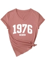 Detail of vintage 1976 V-neck T-shirt showing cracked print and stylish front hem knot - Mauve With White Print