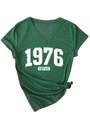 Close-up of a vintage V-neck dark green T-shirt with 1976 print and rolled sleeves - Vintage Green (White Print)