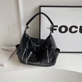 Fashionable black glossy bucket bag with lychee texture and silver ring details - Black