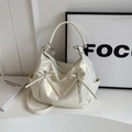 Creamy white glossy leather bucket bag with ribbon bows and detachable strap - Metallic Silver