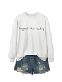 Detail of grey sweatshirt with Happiest When Reading text paired with denim shorts - Off-White (Black Font)