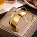 Polished 18K gold stainless steel open bangle with a hollow double-line geometric design - Shiny Gold Style (F3305)