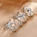 Set di tre anelli regolabili in argento con stelle marine e conchiglie su seta - Collezione Oceano Argento (F634)