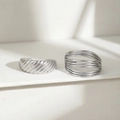 Minimalist silver stainless steel ring set with spiral and layered wire designs on white stand - Silver Spiral Multi-Layer Line Ring Set (C8766)