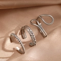 Three-piece vintage hollow stainless steel adjustable ring set on champagne satin fabric - Silver Three-Piece Style (C8864)