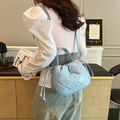 Quilted light blue crossbody bucket bag with drawstring detail and diamond pattern - Blue
