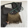 Close-up of olive green suede bag with golden rivets and long bohemian style tassels - Green