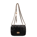 Quilted obsidian black chain crossbody bag with golden twist lock and V-stitch pattern - Black