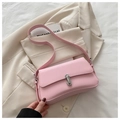 Minimalist light pink leather baguette bag with silver metallic clasp on blazer - Pink
