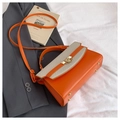 Orange crossbody box bag with woven cream flap and gold-tone lock detail - Orange