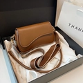 Brown leather saddle shoulder bag with wide woven strap in a premium gift box - Brown
