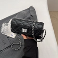 Chic black quilted cylinder bag with silver metal chain strap and rotating lock - Black