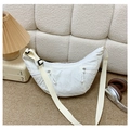 Detailed view of white nylon crescent bag showing front zipper pockets and texture - White