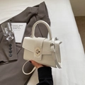 White faux crocodile leather handbag with silver twist lock and round handle - Off White