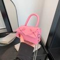Pink mini crossbody bag featuring dual bow accents and a silver chain strap - Pink