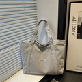 Light blue corduroy tote bag with fashion label on a minimalist windowsill background - Dark Gray