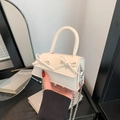 Chic cream mini square bag with dual bow accents and silver chain shoulder strap - Off-white