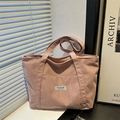 Pink corduroy tote bag with Fashion Instinct label shown in a lifestyle minimalist setting - Pink