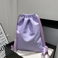 Chic lavender drawstring bucket bag made of satin fabric for women's shoulder or backpack use - Purple