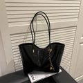 Chic black patent leather tote bag with glossy finish and decorative bell charm - With Pendant / Black