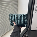 Quilted dark green puffer clutch bag in glossy finish with sleek minimalist design - Green