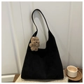 Detail of black suede tote bag with soft texture and a cute brown plush puppy charm - With Pendant / Black