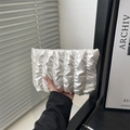 Silver metallic pleated cloud clutch bag with minimalist vertical texture and glossy finish - White
