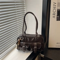 Deep brown glossy leather bowling bag with front pockets and beaded charm accessory - Brown