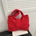 Red bow-shaped shoulder bag featuring a pleated design and a soft fabric finish - Red