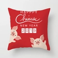 Detail of red festive cushion cover with cartoon pig illustration and New Year text - Red Base Warm Cartoon Pig New Year Style (xmas7-15)