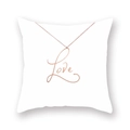 Close-up of rose gold Love cursive pendant necklace resting on a soft white cushion - Rose Gold Love Text Style ((35)DM207)