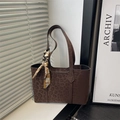 Dark coffee leopard print tote bag with decorative silk scarf on window background - Brown