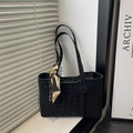 Leopard print black tote bag with decorative silk scarf handle on a minimalist background - Black