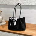 Large black suede tote bag with decorative printed silk scarf on wooden surface - Black